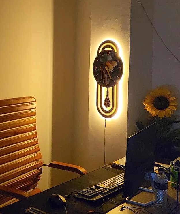 Shop this Modern LED Backlit Wall Clock with a stylish round design and warm ambient glow. Perfect f — back view